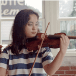 Girl Holding a Violin Bow