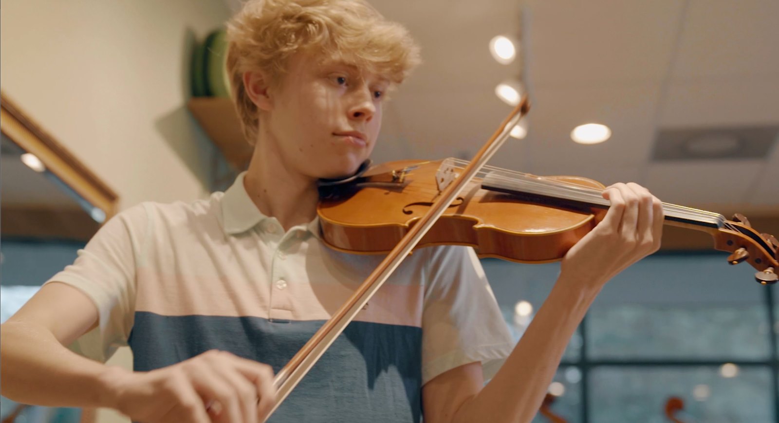 boy practicing violin
